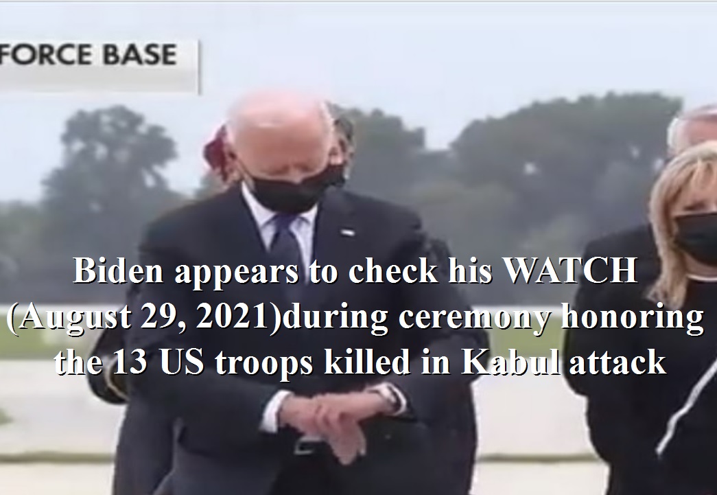 Biden appears to check his WATCH during ceremony honoring the 13 US troops killed in Kabul attack